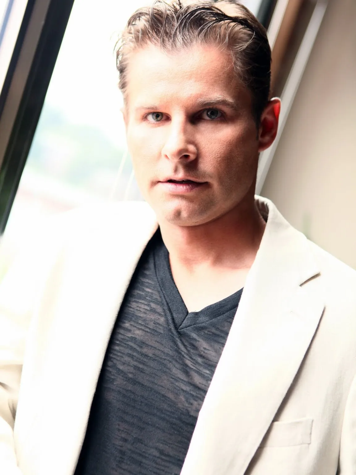 Portrait of SAG-AFTRA actor Jerry Lobrow in a cream blazer