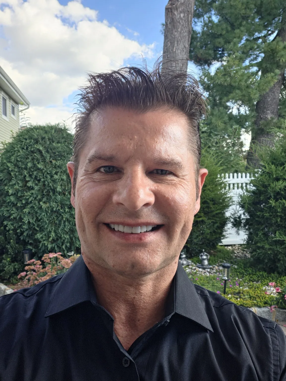 Jerry Lobrow smiling in a black shirt outdoors